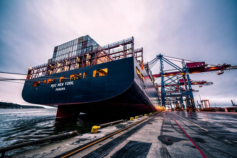 Container vessel alongside a port crane